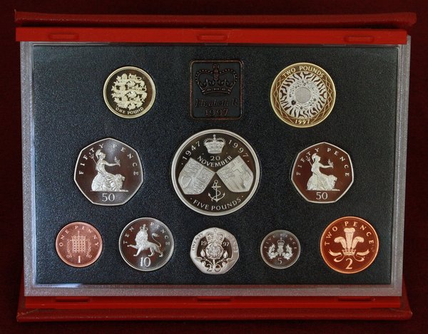 1997 Proof Set.<br />The year saw the introduction of the smaller 50p coin and the new style bi-colour £2 coin.<br />The £5 coin (centre) was to commemorate the Queen and Duke of Edinburgh's Golden Wedding